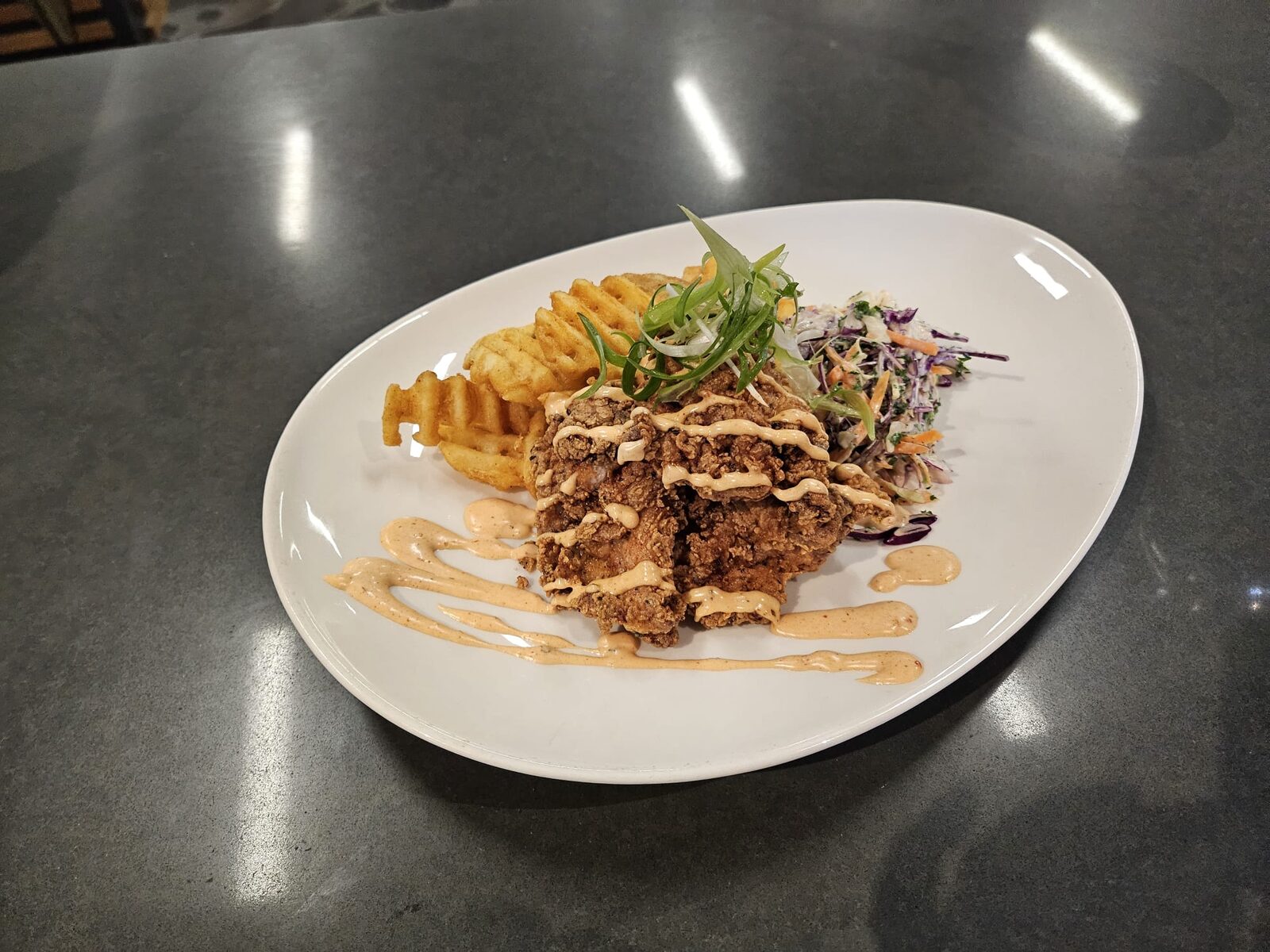Fried chicken with waffle fries - The Spitfire Restaurant