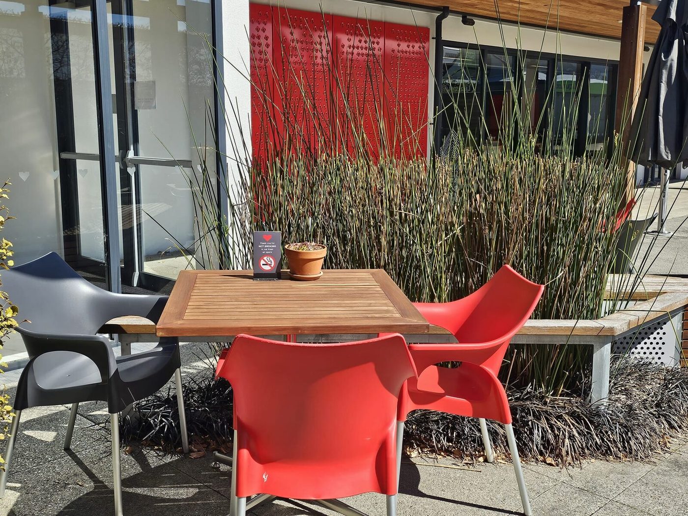Courtyard tables and chairs in the sun